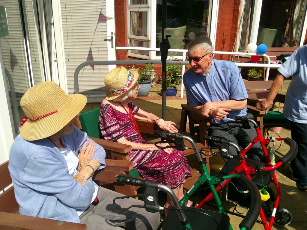 Smiling residents during VE Day 80th anniversary event